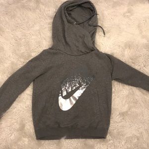 grey nike hoodie with silver metallic logo
